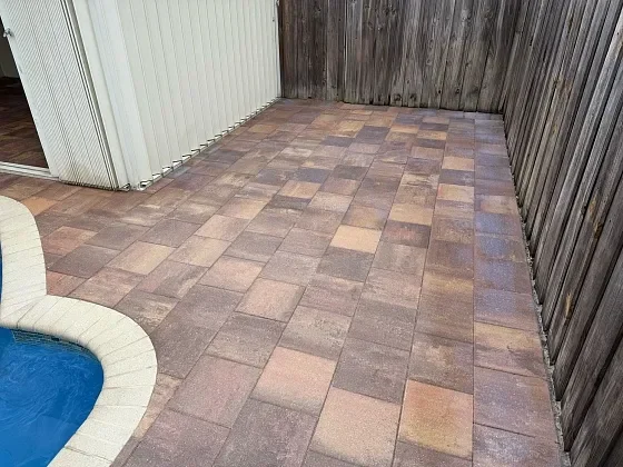 Outdoor living space featuring patio and pool deck pavers in Pompano Beach, FL