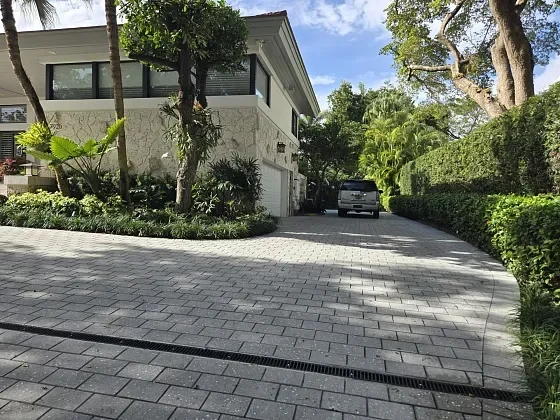Concrete paver driveway replacement designed to prevent water pooling in Palm Beach Gardens, FL