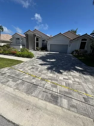 Outdoor living area with restored pool deck and patio pavers in Palm Beach, FL