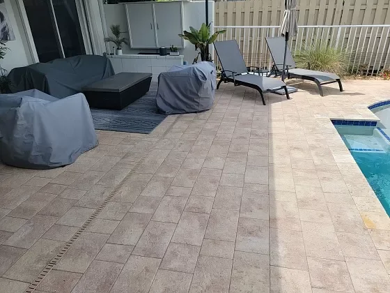 Restored pool deck pavers with smooth, even surface in Boca Raton, FL