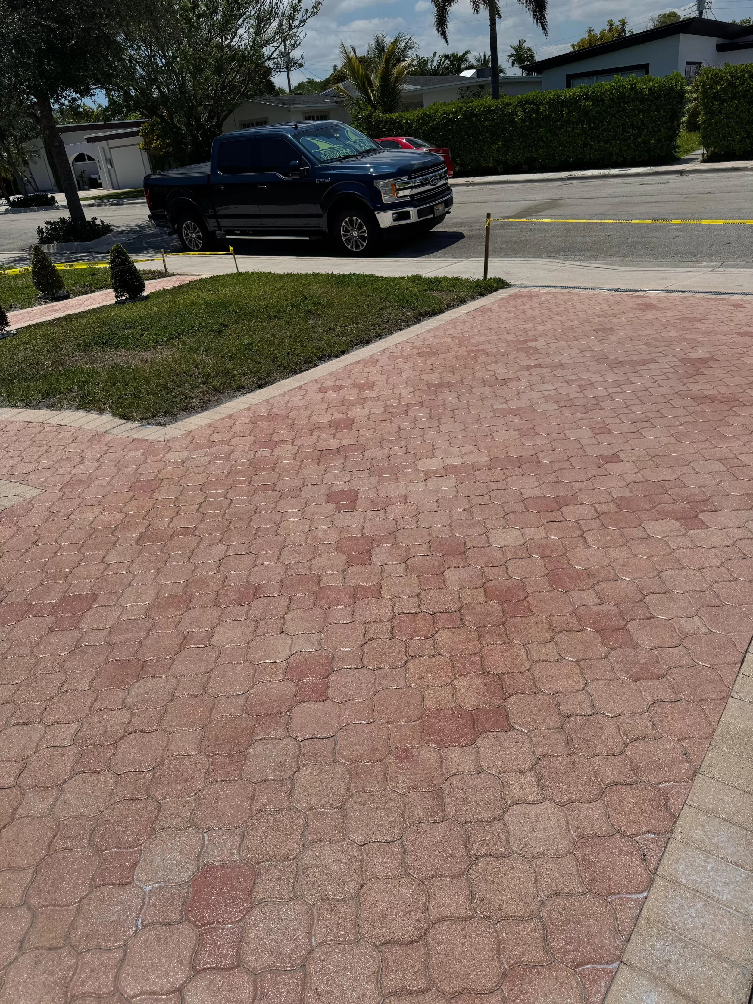 Driveway and paver walkway alignment after professional cleaning in North Bay Village, FL
