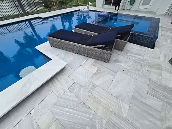 Pool deck and patio pavers arranged for modern outdoor living in Palm Beach, FL