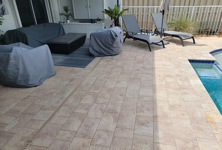 Backyard paver patio installation in South Florida with clean lines and professional base preparation.