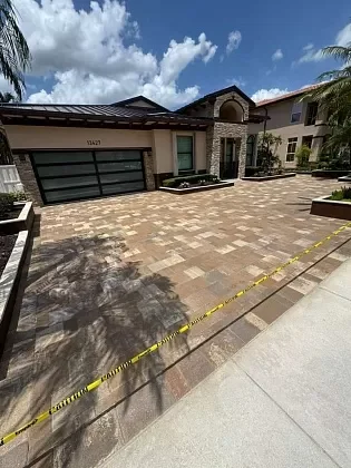 Paver driveway after professional cleaning and sealing in Fort Lauderdale, FL