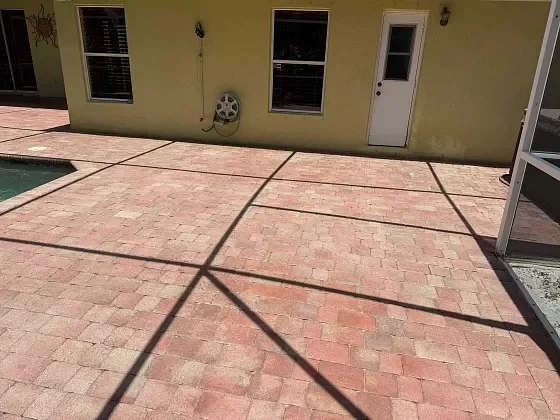 Pool deck pavers refreshed through cleaning and sealing in Broward County, FL