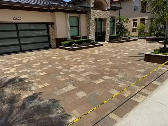 Outdoor living entry with paver walkway leading to residence in Fort Lauderdale, FL