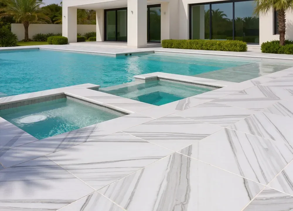 Marble pool deck installation creating a clean outdoor living space in Palm Beach, FL