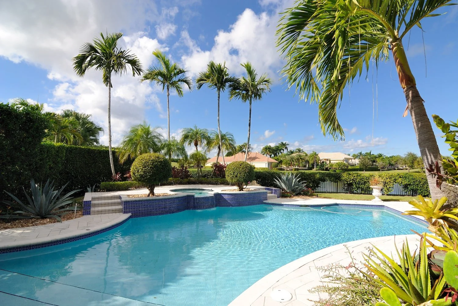 Pool deck with smooth transitions to nearby patio areas in Palm Beach, FL