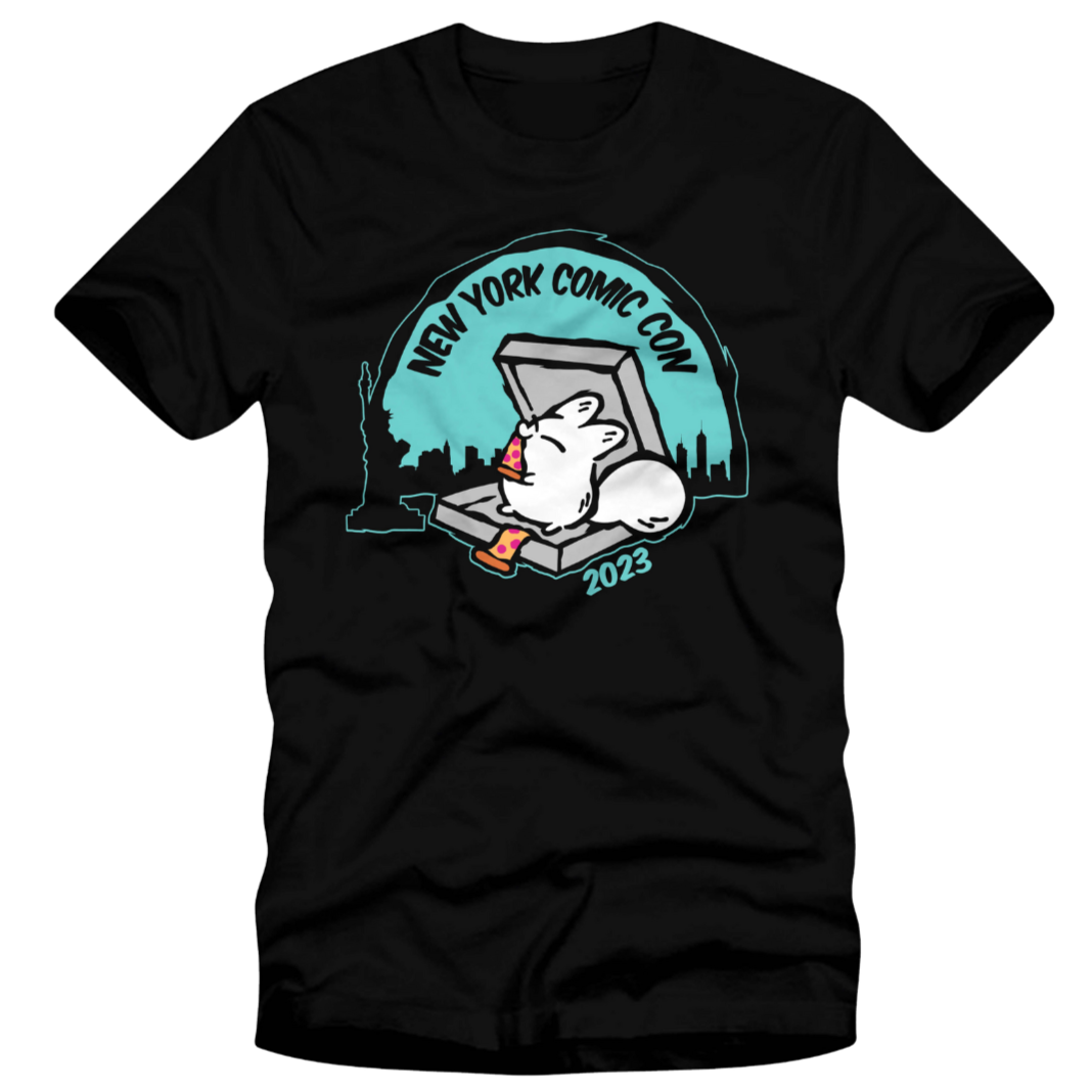 Black T-shirt with a cartoon rabbit emerging from a box, with city skyline and the text 'New York Comic Con 2023'