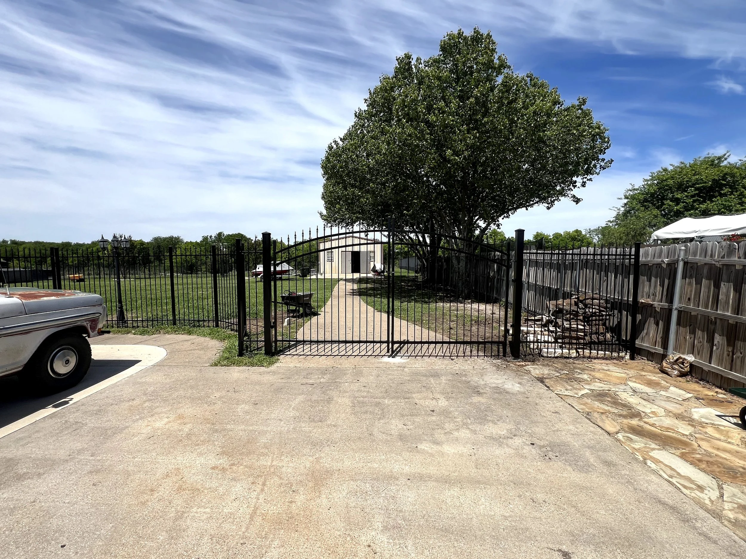 wrought iron fence with wrought iron drive gate