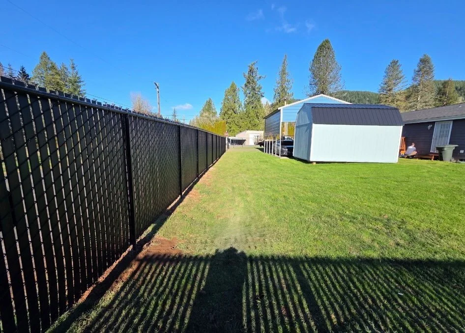 black chain link fence with privacy slats royse city