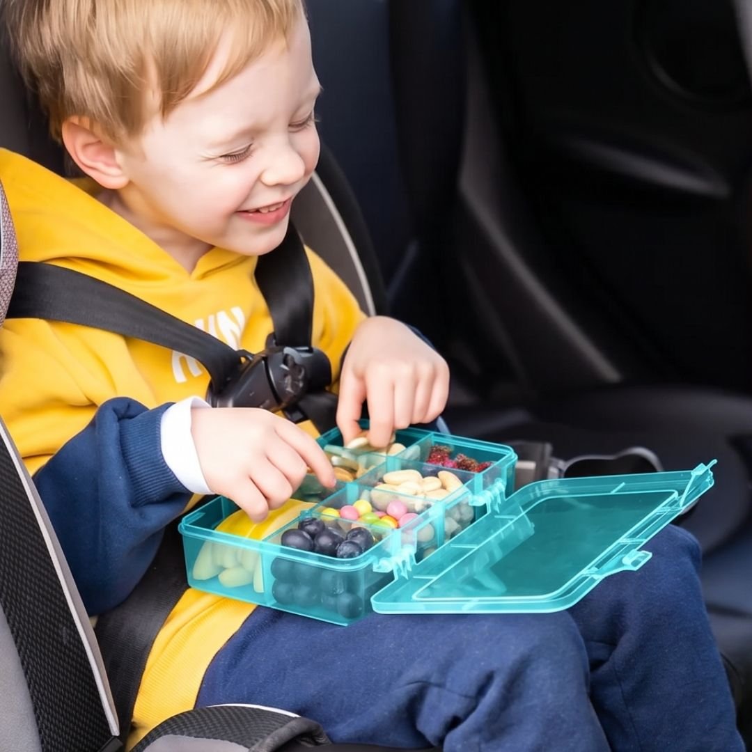 Kid sitting in car with Mothercould Snack Box
