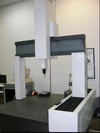 Coordinate measuring machine (CMM) in a laboratory setting.