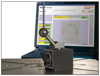 A computer monitor displaying a technical analysis interface with a circular diagram, a dial gauge, and measurement tools on a workbench.