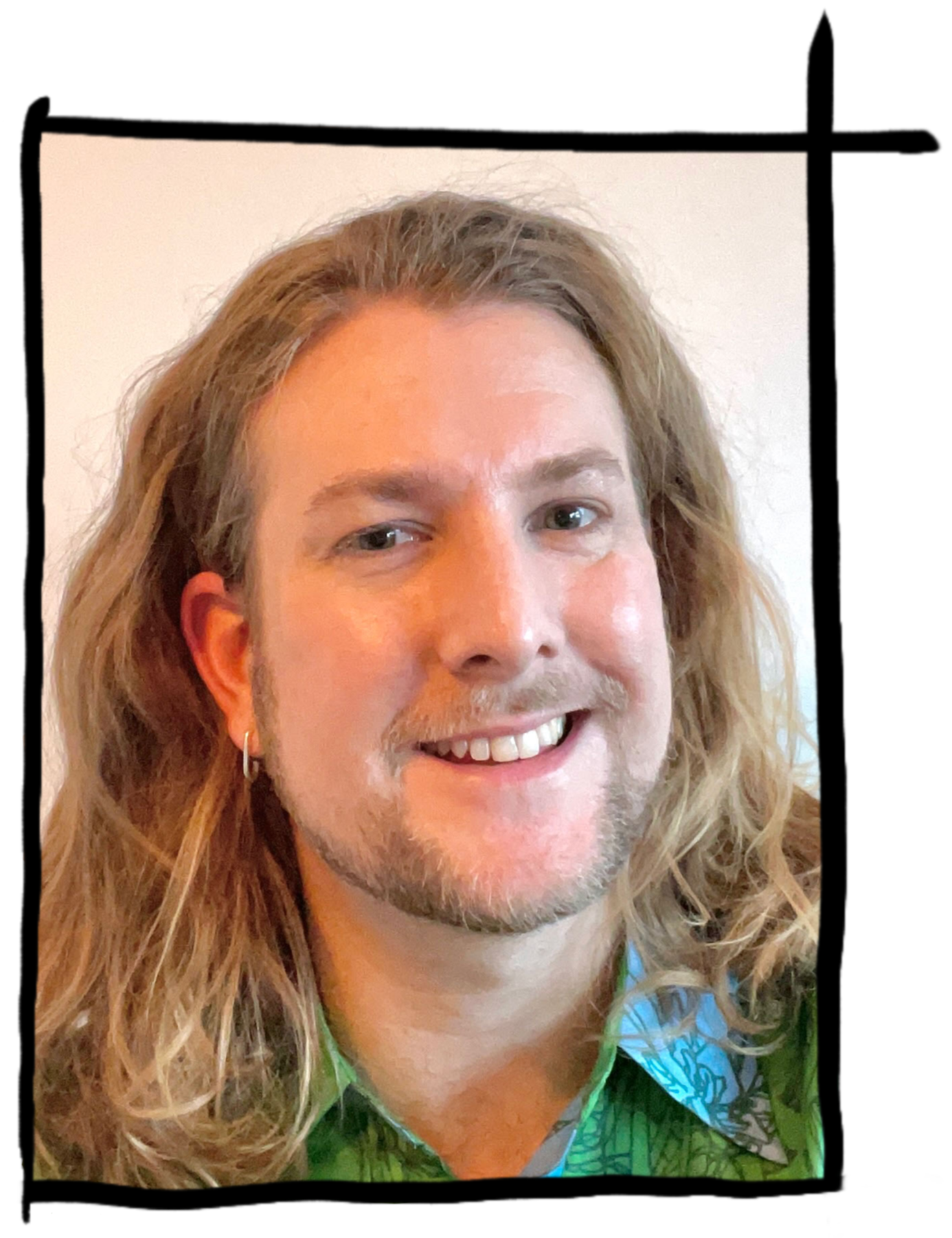 Close-up of a smiling man with long wavy blonde hair, wearing a green patterned shirt, earrings, and light facial hair.