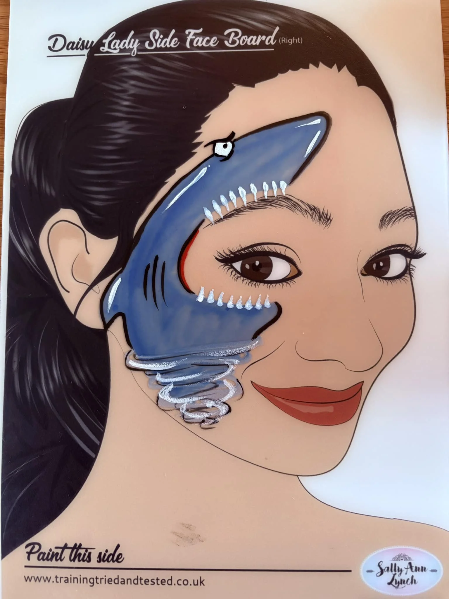 Shark tornado face paint on child