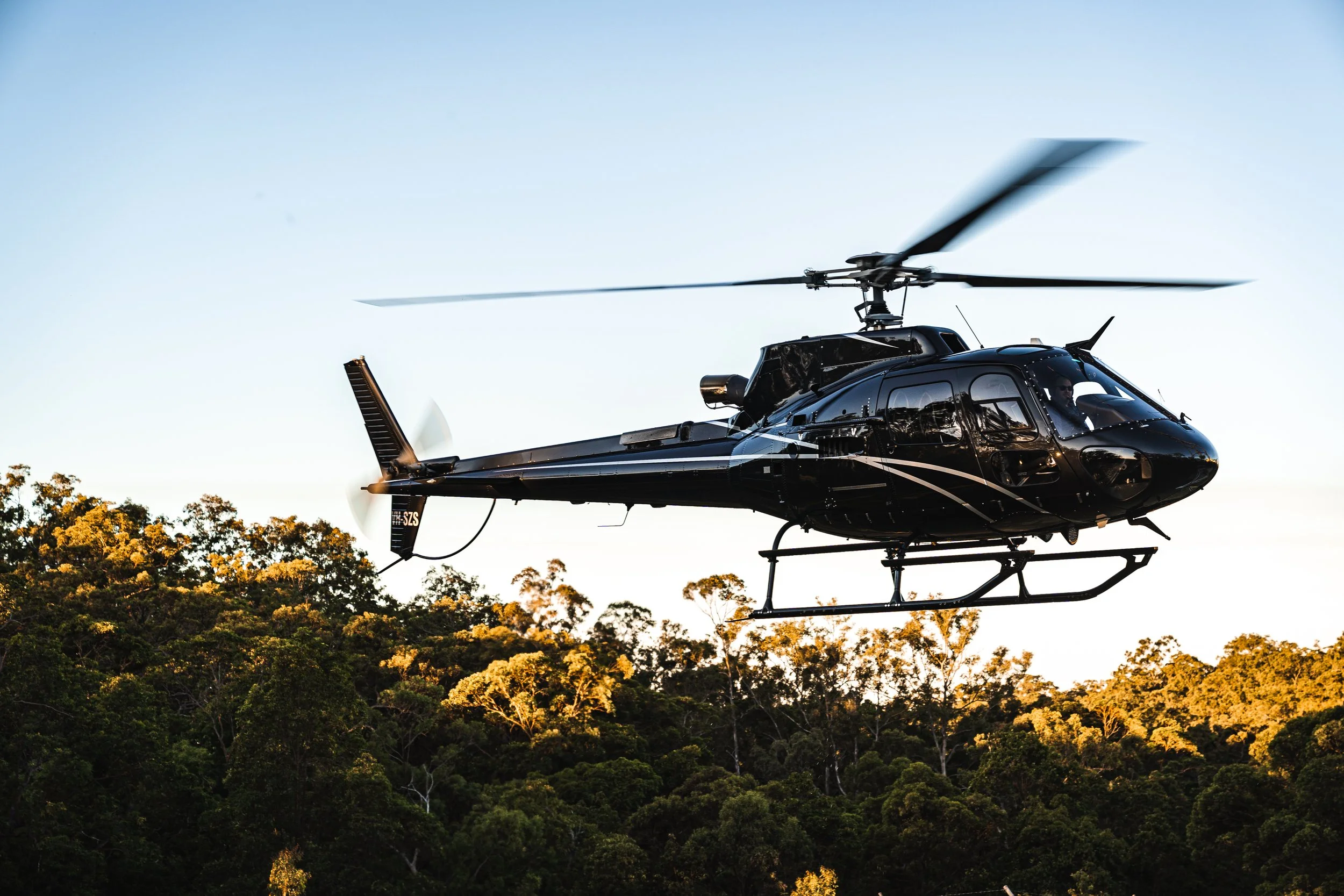 Private helicopter arrival at luxury wellness retreat in Byron Bay Hinterland
