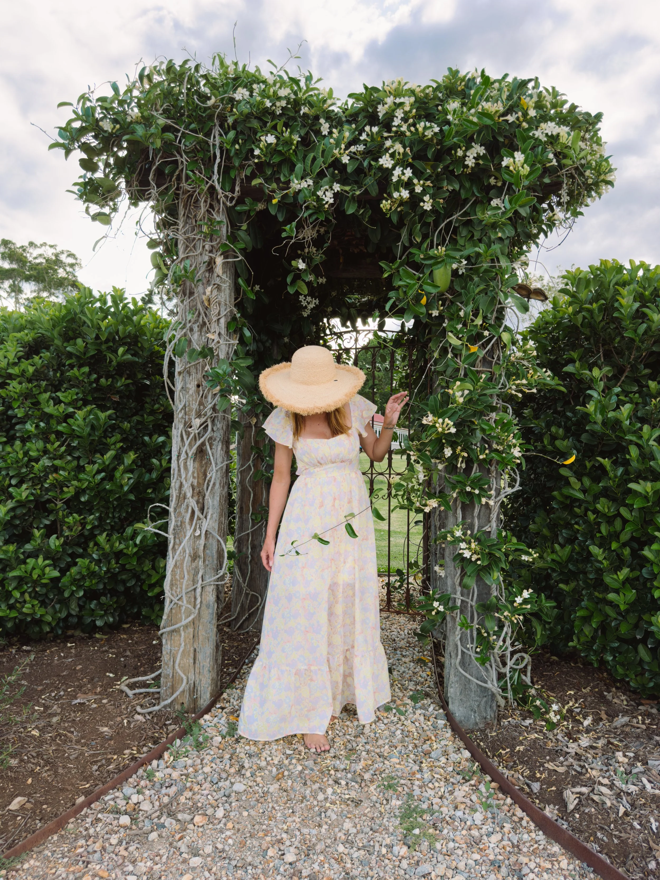 Garden archway surrounded by greenery at a boutique retreat and wedding venue in Byron Bay Hinterland