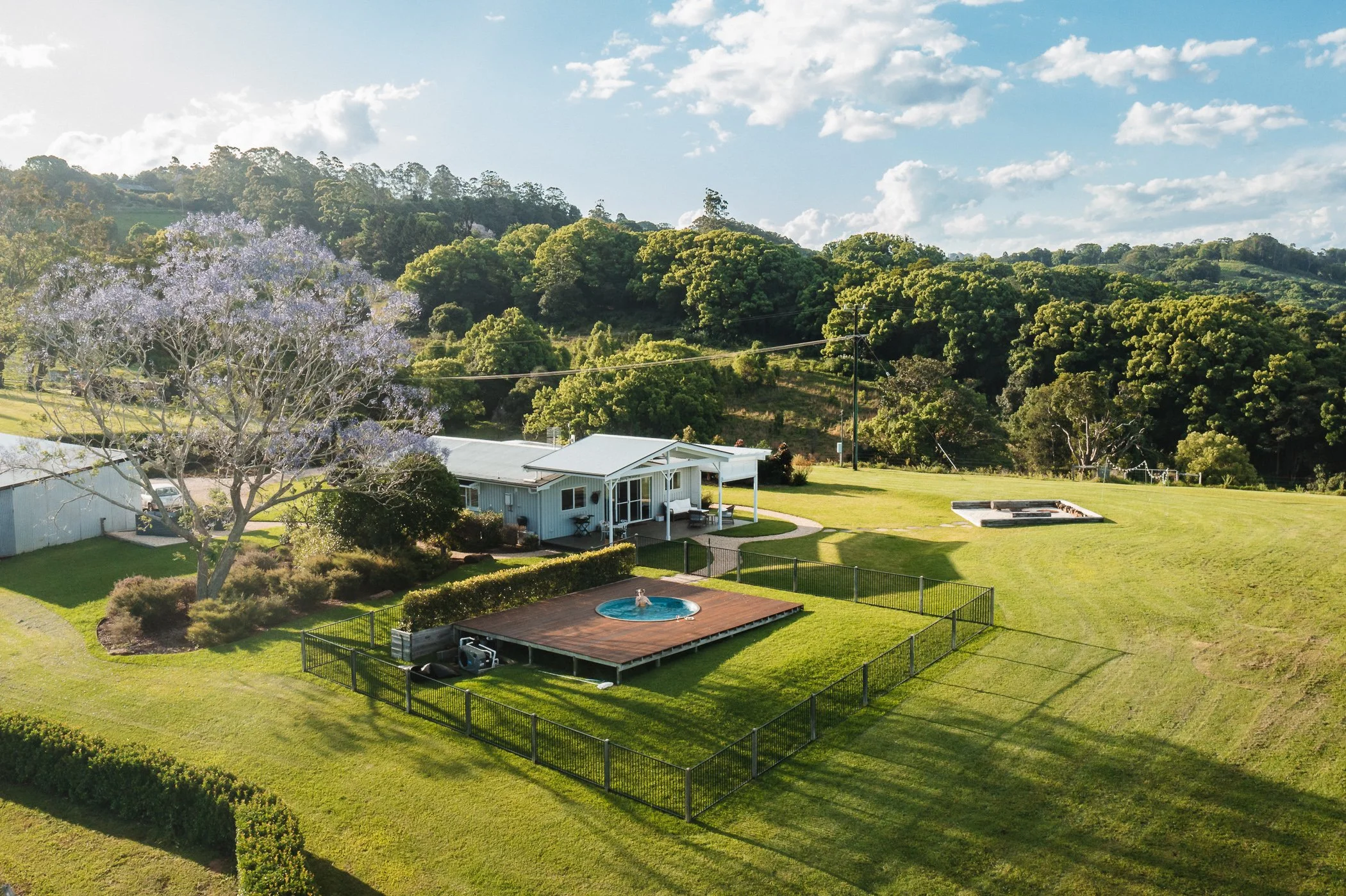 Aerial view of Heartwood Farm Byron Bay private wellness retreat with luxury cottage and surrounding countryside