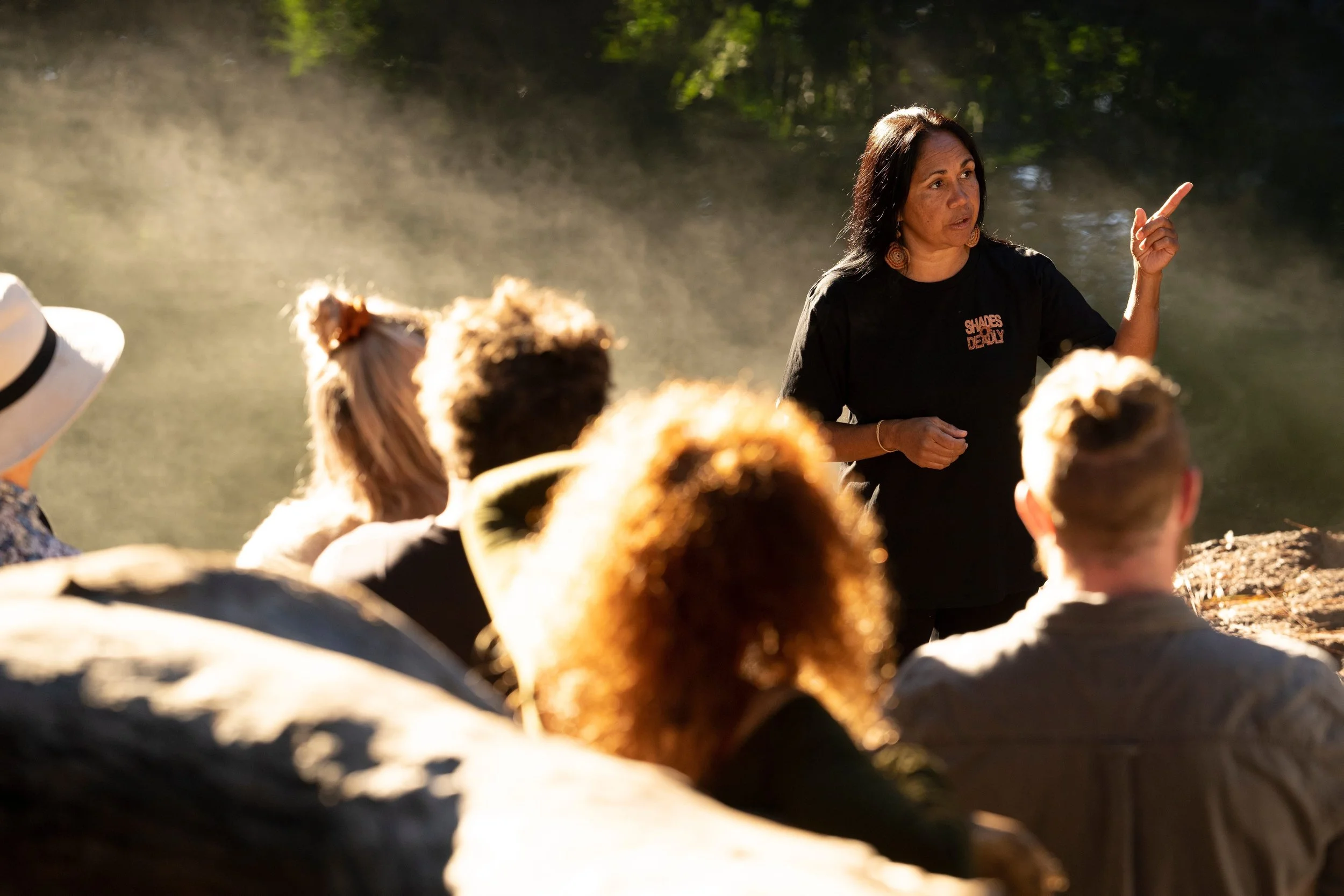 Delta Kay guiding a cultural leadership experience during a corporate retreat in the Byron Bay Hinterland