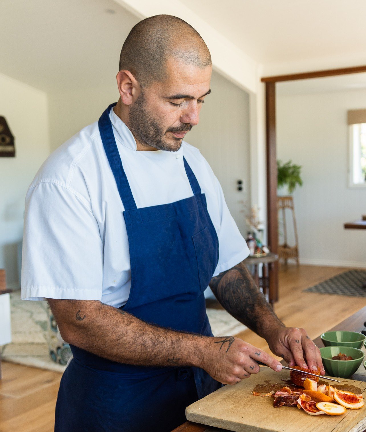 Private chef preparing fresh seasonal meal at luxury wellness retreat in Byron Bay Hinterland