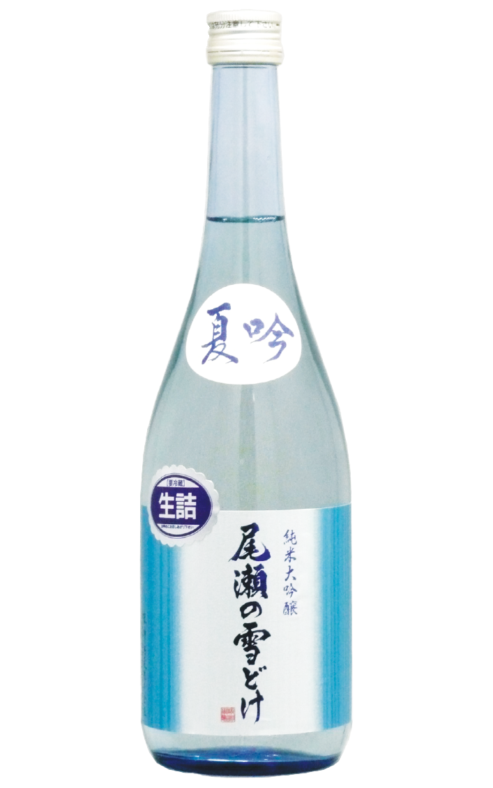 A tall, clear glass bottle of Japanese sake with a white screw cap and a predominantly white and blue label containing Japanese characters.