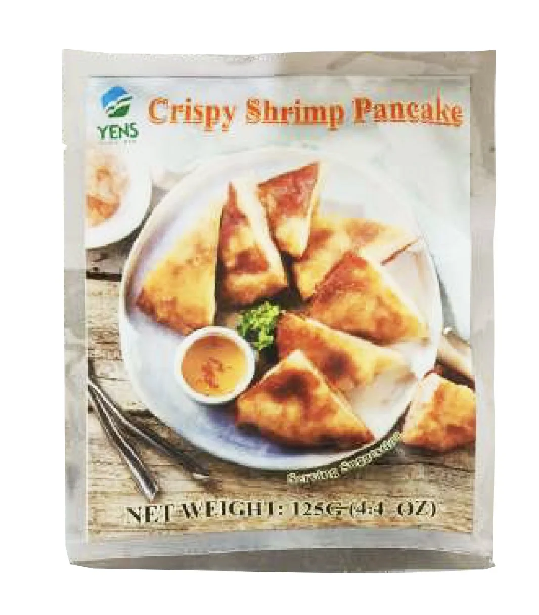 A package of crispy shrimp pancake with a plate of cooked shrimp pancake arranged with a small bowl of dipping sauce and garnished with parsley. The package has the product name and weight written on it.