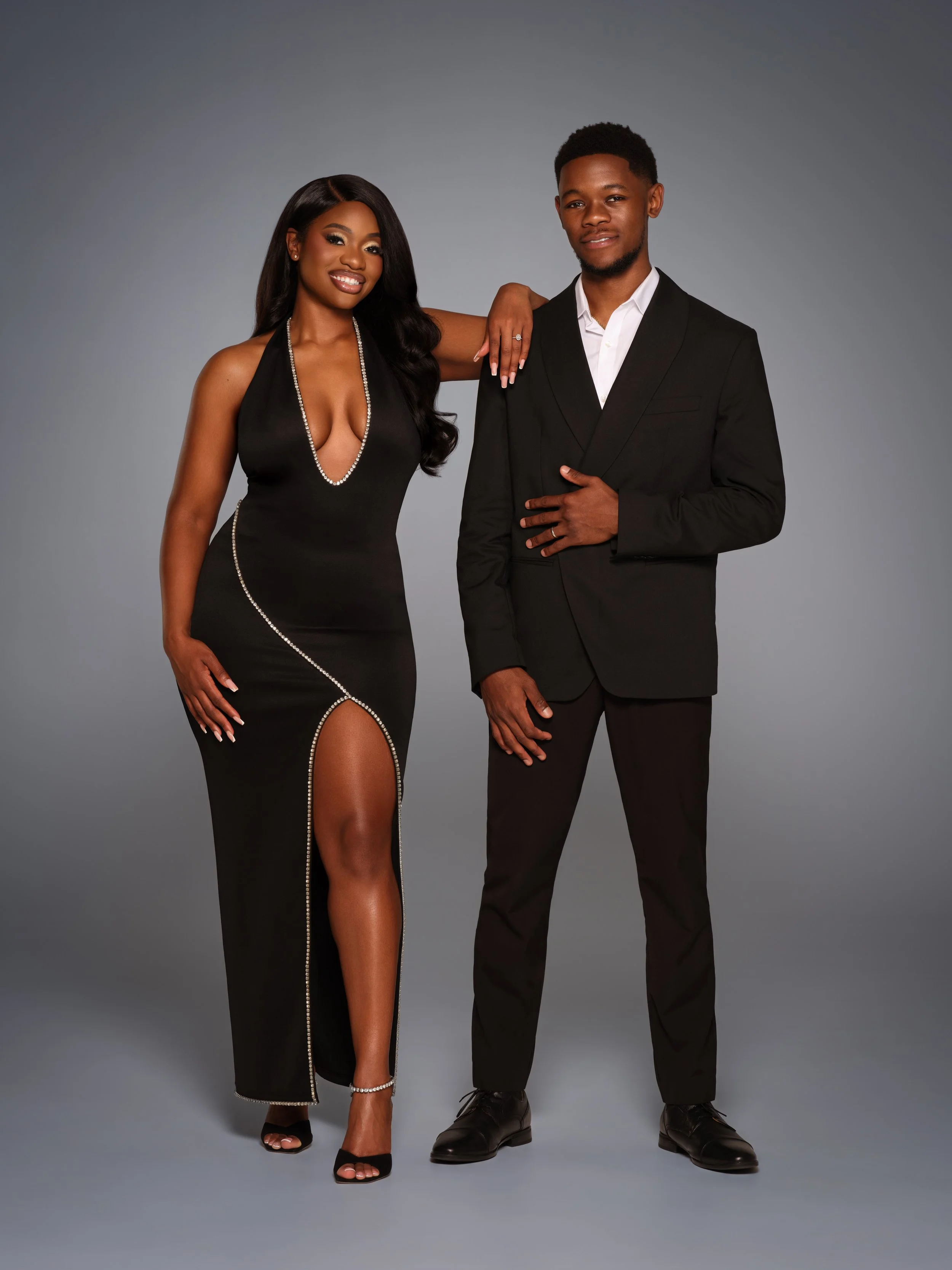 Man and Woman Posed in formal black attire