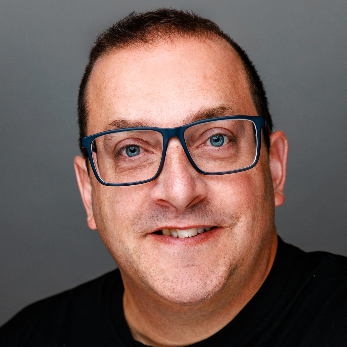 Shawn Batten, co-founder of Laser Tag Ottawa, community-focused entrepreneur and youth mentor, pictured smiling in a professional headshot.