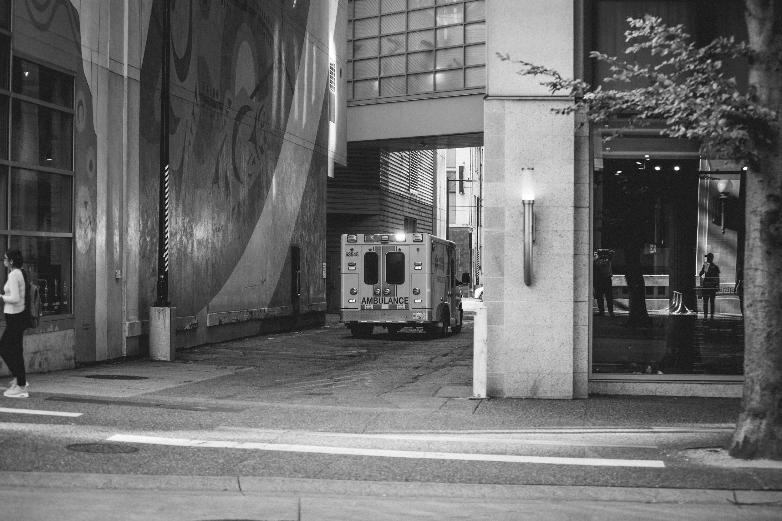An ambulance in an urban setting, representing specialized counseling for trauma and PTSD experienced by emergency medical services personnel.