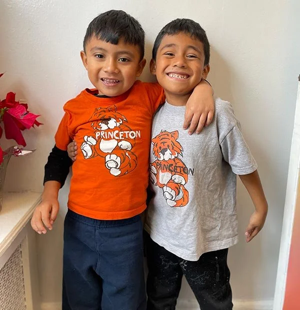 Two PNS children smiling at camera