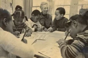 PNS Teacher with children taken back in the 70s-80s