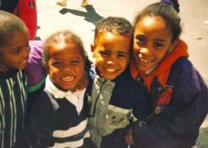 PNS children smiling at the camera