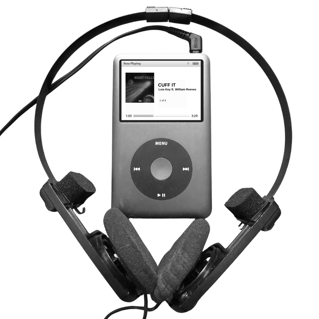 A silver iPod Classic with a click wheel displaying a music playlist, surrounded by black headphones with foam ear cushions, all placed on a black surface.