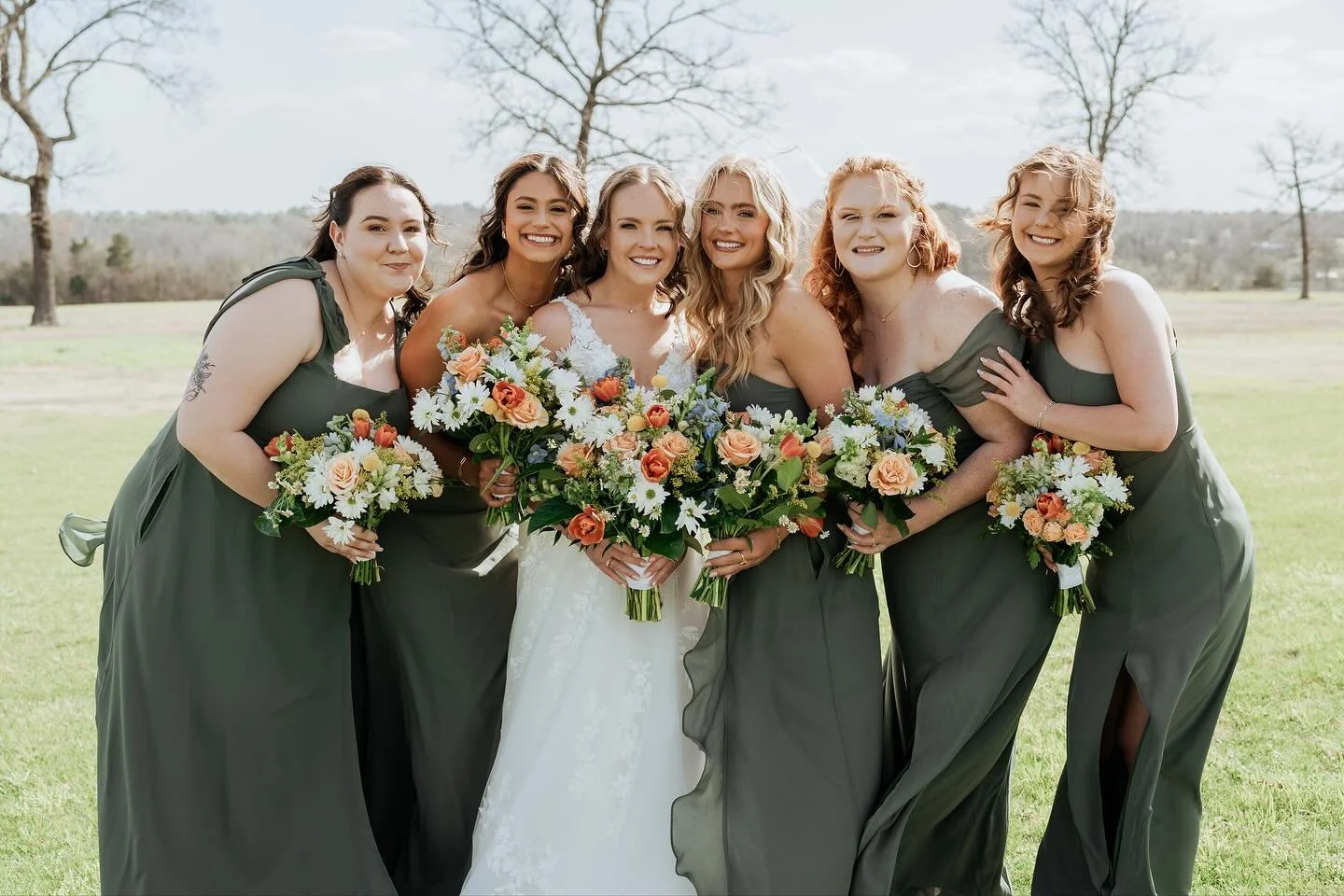 A bride and groom laughing joyfully under a sunset sky, surrounded by friends and family, all smiling with happiness. 💍  #dfw #ftw #weddinginspo #weddingvendor #texasweddingphotographer #sunset #bridalmakeup #bridalhair  Photographer: @tarasmithphot