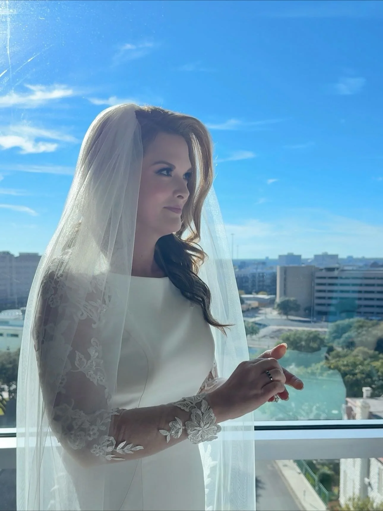 That &lsquo;just married&rsquo; glow! ✨ Obsessed with this bride&rsquo;s radiant complexion and soft, voluminous waves underneath her veil. Swipe to see the whole gorgeous party! The simple sophistication of the hair and makeup lets her natural beaut