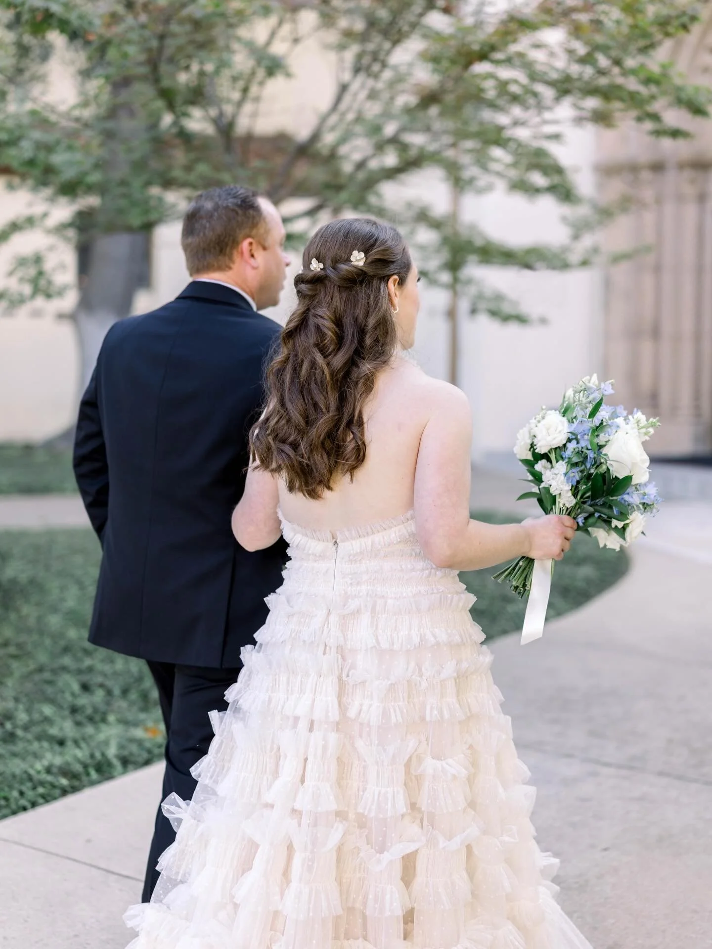 We are head over heels for this romantic bridal look! Between the intricate, braided half-up style accented with a sparkling tiara and those soft, flowing waves, every detail was pure elegance.
.
.
.
#BridalMoments #WeddingDayJoy #FullServiceBridal #