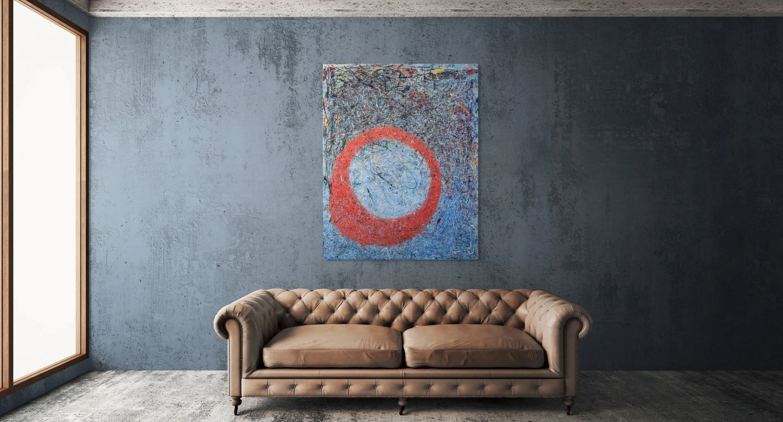 Modern living room with a textured blue wall, a brown tufted leather sofa, a large abstract painting with a red circle on the wall, and a window with wooden framing on the left.