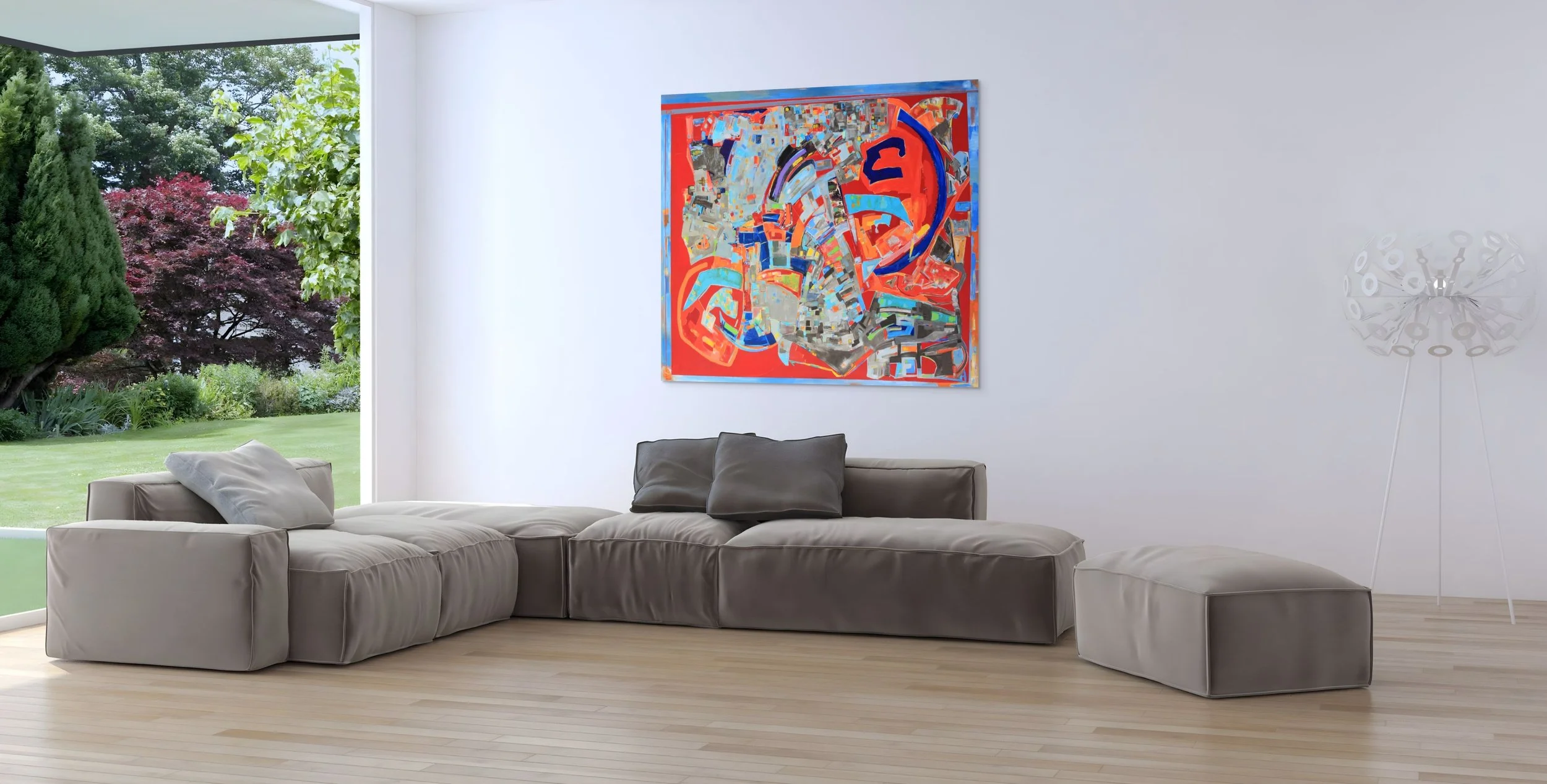 Living room with a large gray sectional sofa, gray pillows, colorful abstract painting on white wall, floor lamp, and large window showing a green garden outside.