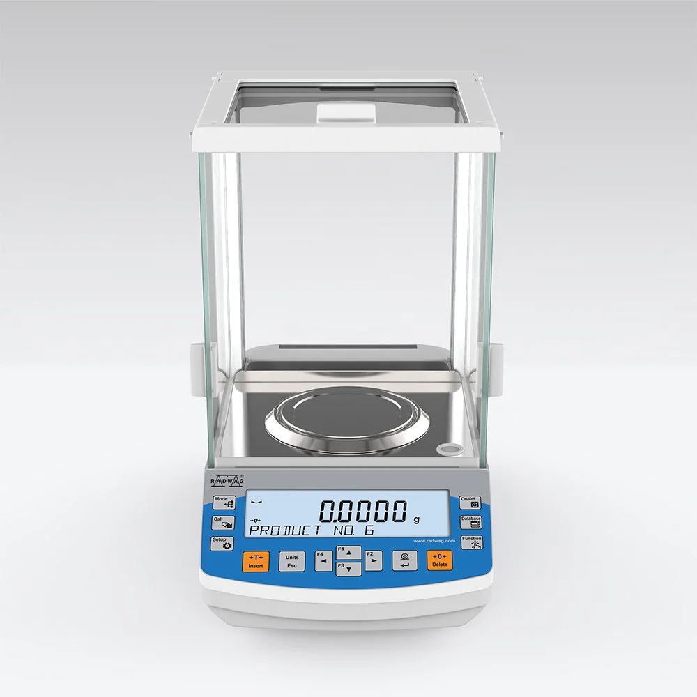 A digital laboratory scale with a glass enclosure and a circular weighing platform, displaying a weight of 0.0000 grams.