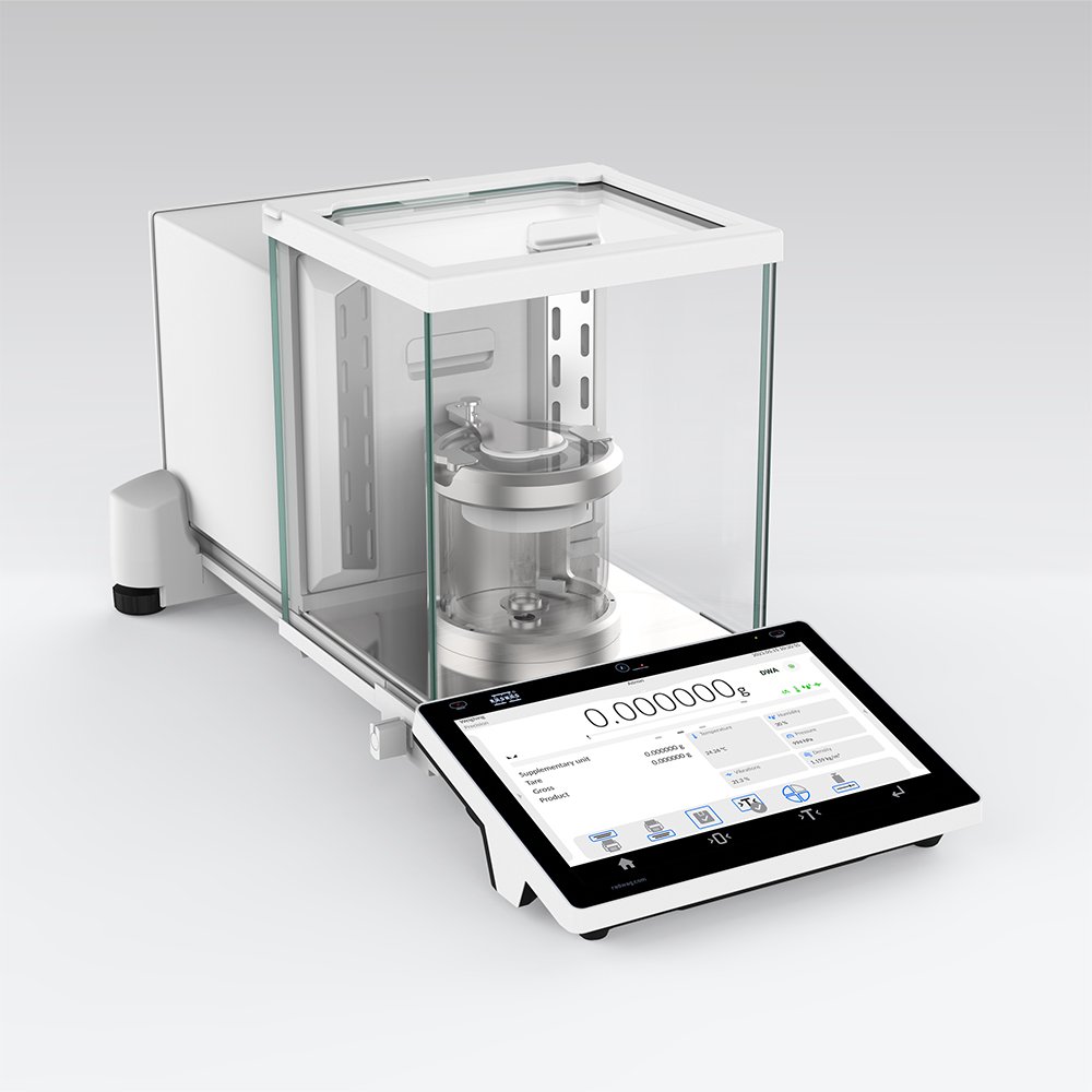 A laboratory analytical balance with a digital touchscreen display and a glass enclosure.