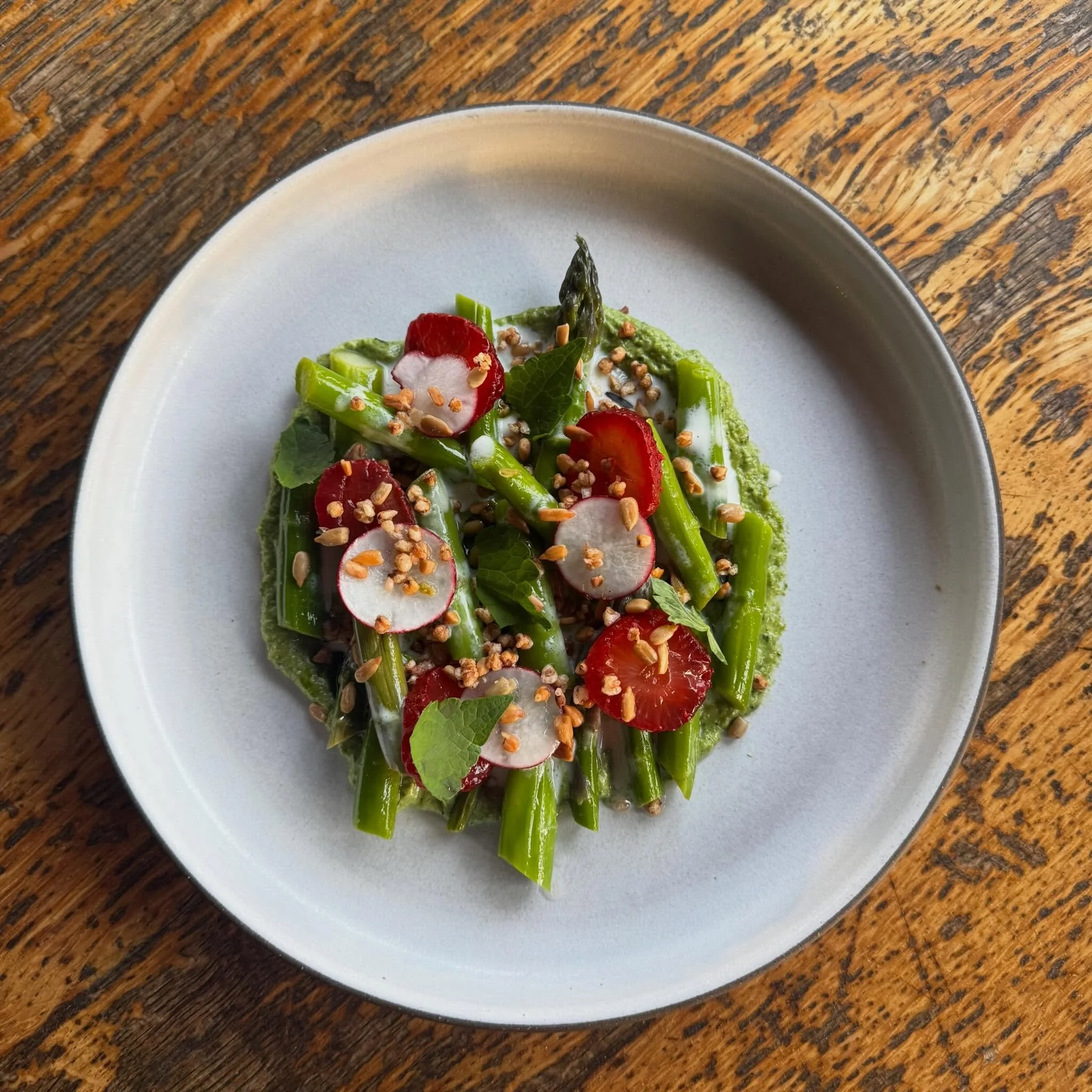 Spring things are happening 🌱 Asparagus with strawberries, buttermilk, asparagus pistou, sunflower seeds and buckwheat. 

Join us for our spring menu, book now on @opentable