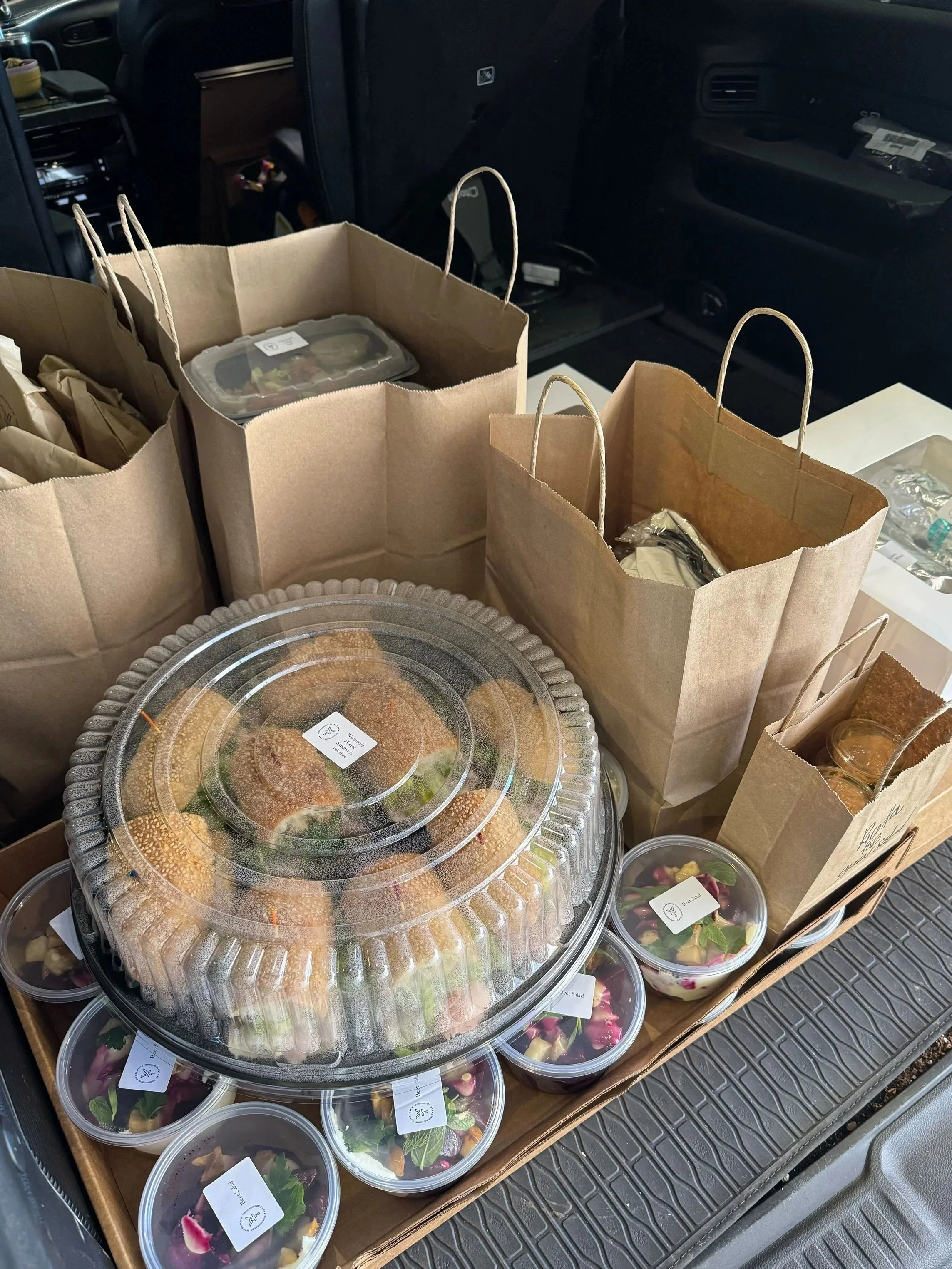 sandwiches and salads packed for delivery catering