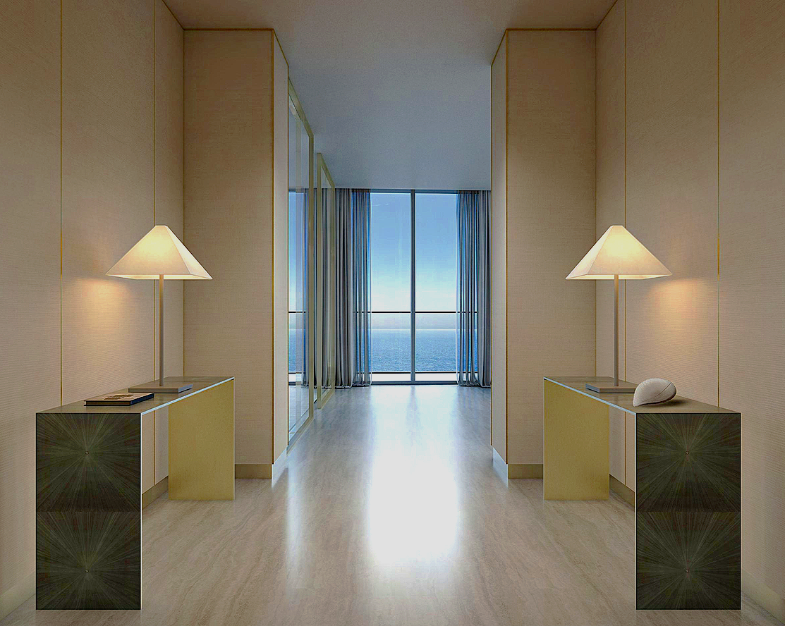 Minimalist interior with two identical nightstands each with a lamp, facing a large window with a view of the ocean.