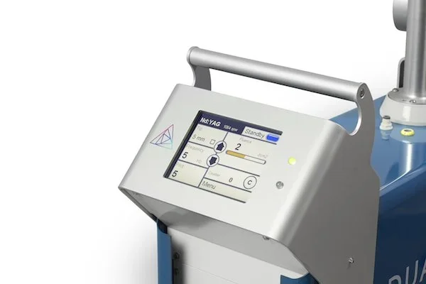 Close-up of a medical device with a digital touchscreen display and control panel.