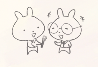Two cartoon rabbits with large heads and small bodies, one holding a microphone. They are smiling and in conversation.