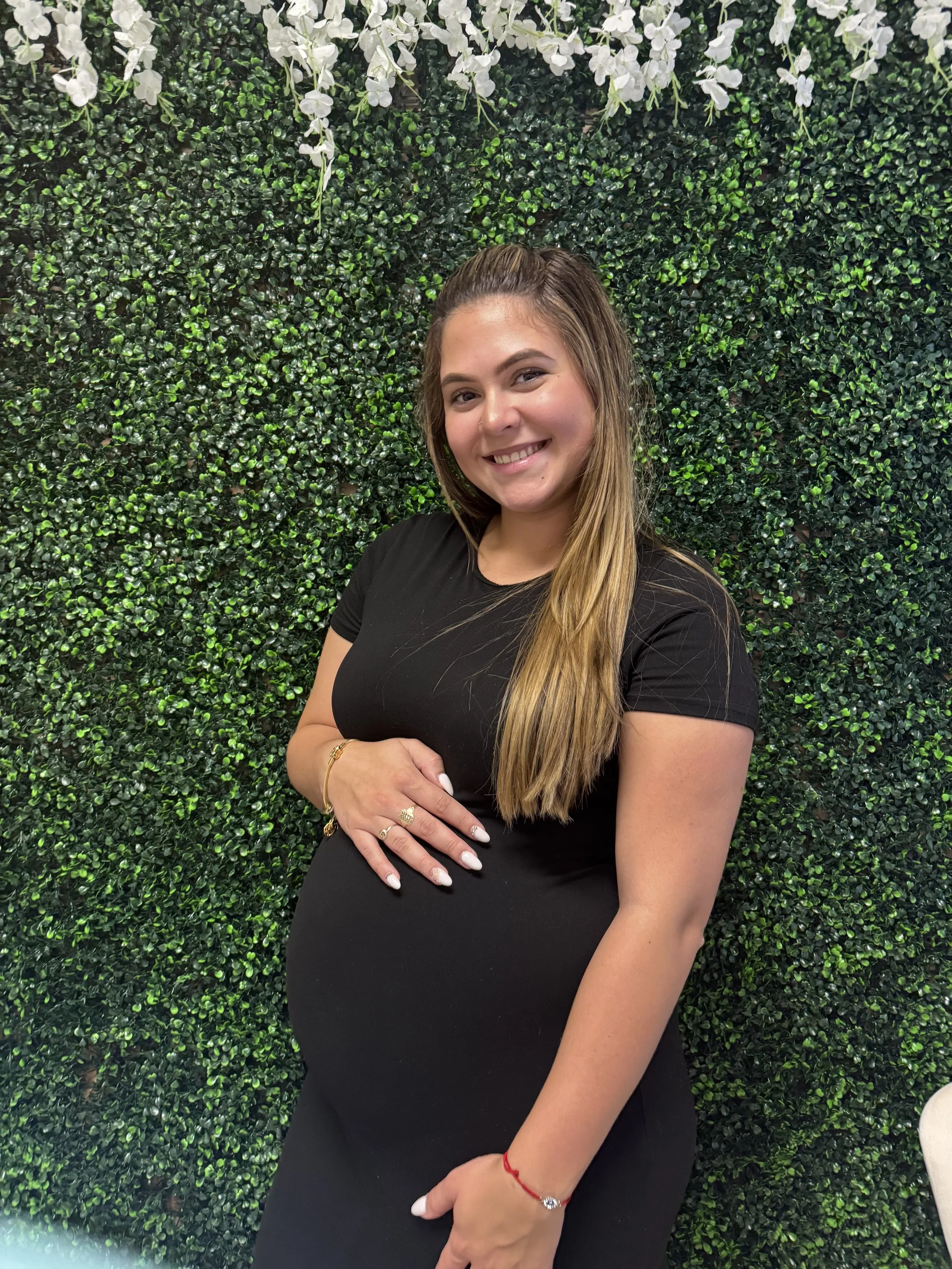 Smiling client celebrating positive 2D pregnancy confirmation ultrasound