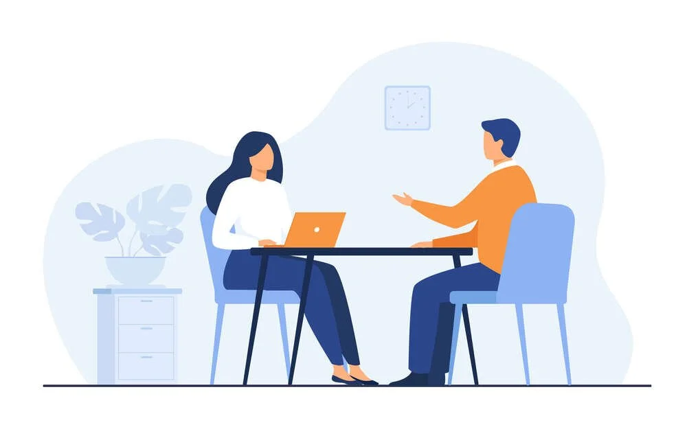 Illustration of two people sitting at a table having a conversation. One person has a laptop, and there is a plant and a small drawer nearby.
