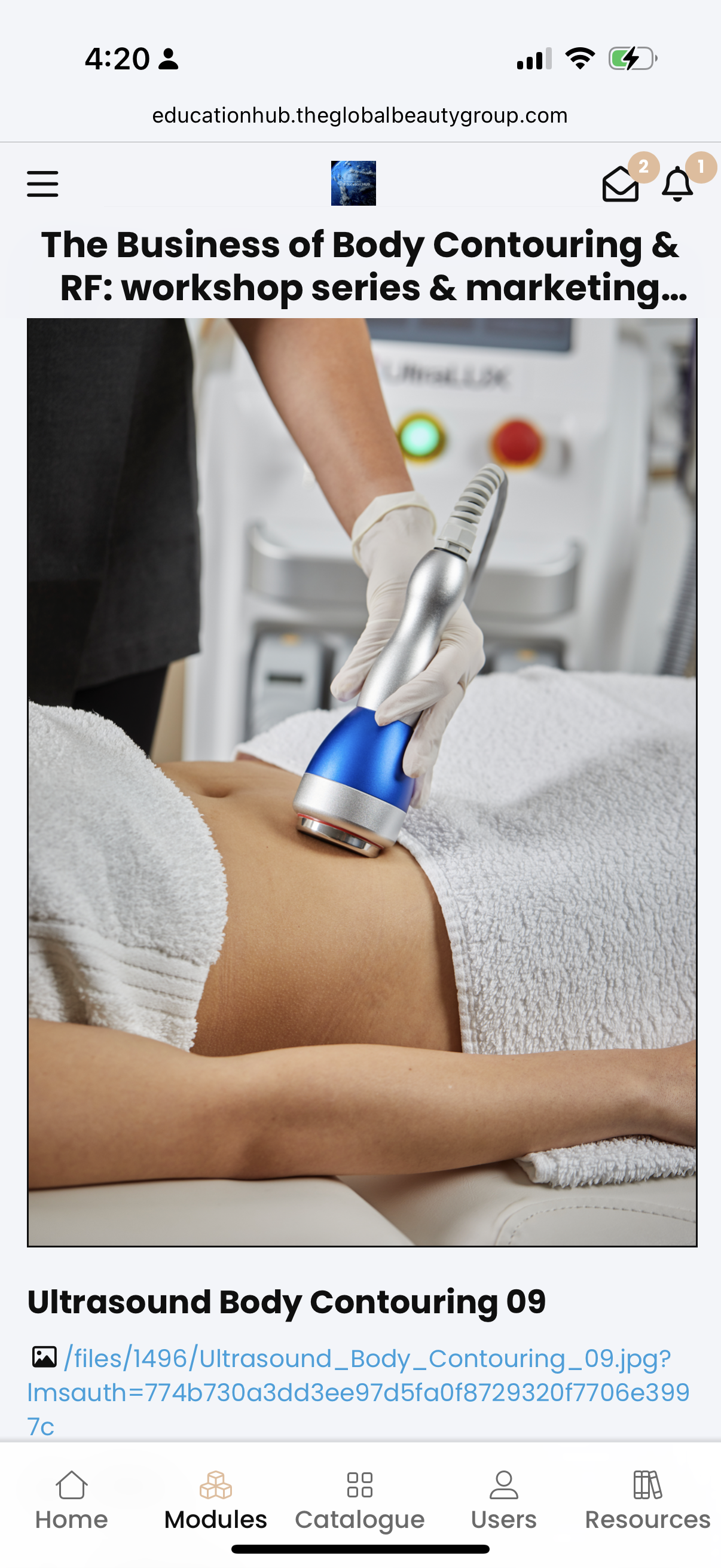 A person is receiving an ultrasound treatment on their abdomen in a clinical setting, with medical equipment and a technician wearing gloves.
