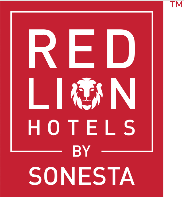 Red Lion Hotels by Sonesta logo with white text and a lion face in the center, on a red background. Image is a link to the corresponding company.
